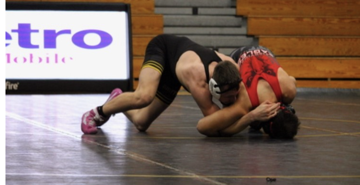 Joseph Hedrick fights for the win against his opponent during a match in mid-January.